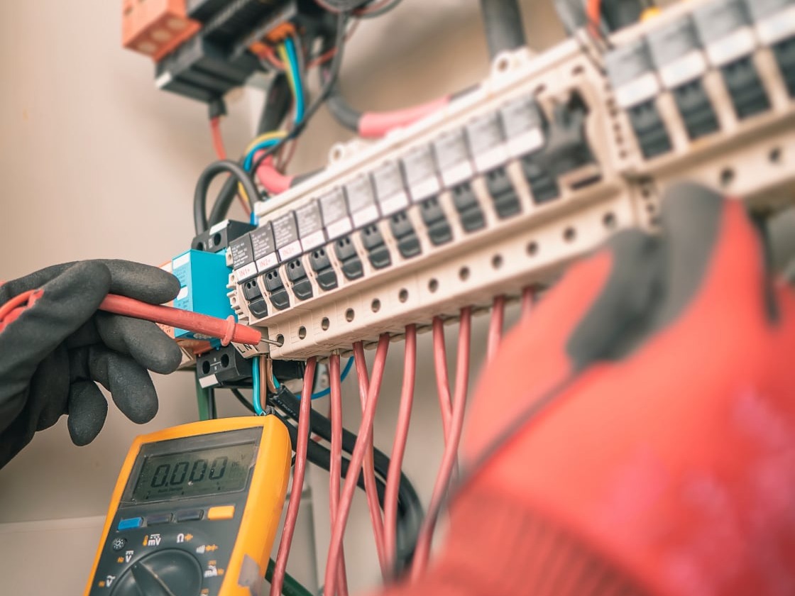 Engineering used a multimeter to measure the voltage of electrical wires